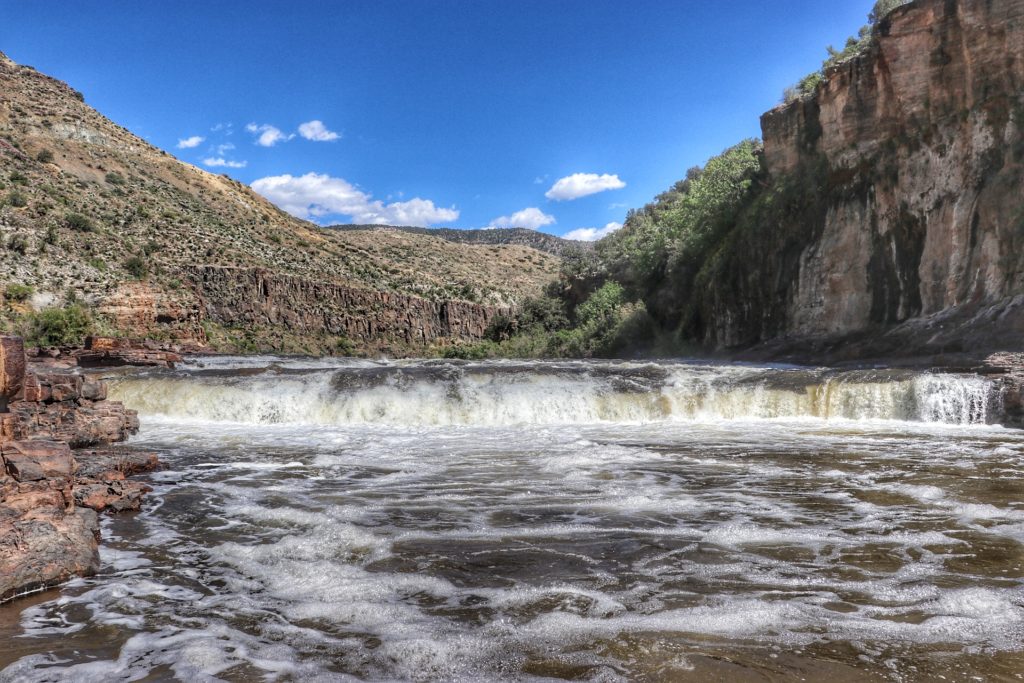 Apache Falls with canyon scenery in the background.